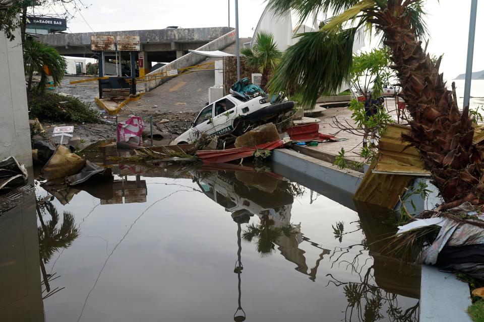 A street is strewn with debris after Hurricane Otis ripped through Acapulco, Mexico, on Wednesday.