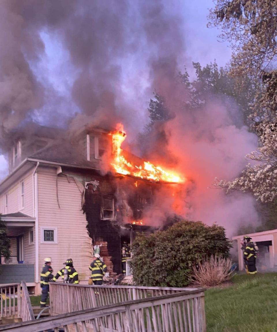 Reponders used a ladder to rescue a man from the second floor of this residential fire Sunday in Rockaway Township.