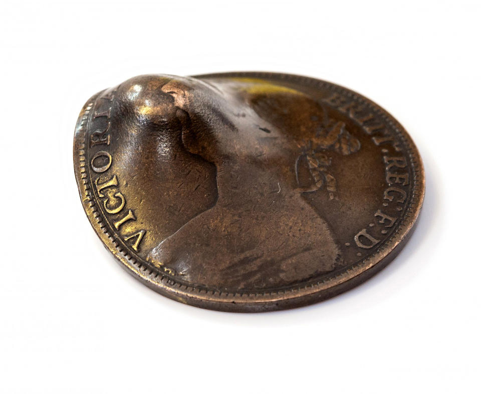 The coin was left dented after it saved the soldier. (PA)