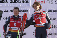 From left, second placed Norway's Henrik Kristoffersen and the winner Norway's Lucas Braathen on podium after an alpine ski, men's World Cup giant slalom, in Alta Badia, Italy, Sunday, Dec. 18, 2022. (AP Photo/Alessandro Trovati)