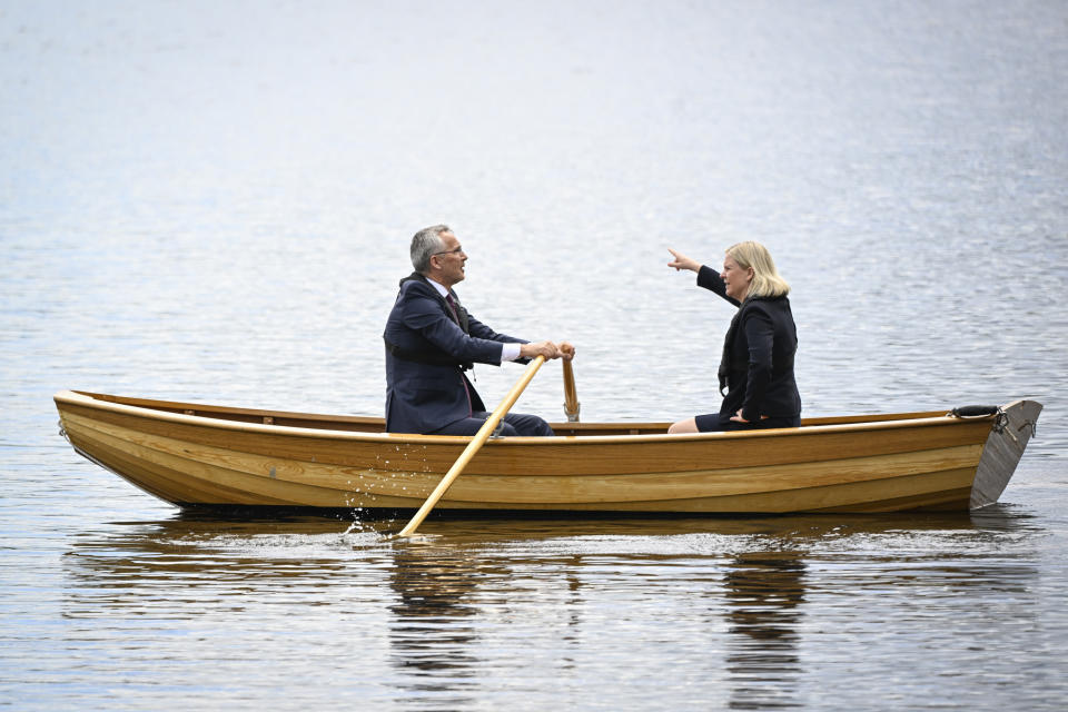 Sweden's Prime Minister Magdalena Andersson, right, and NATO Secretary General Jens Stoltenberg talk on a traditional rowboat during their meeting at Harpsund, the country retreat of Swedish prime ministers, Monday, June 13, 2022. (Henrik Montgomery/TT News Agency via AP)