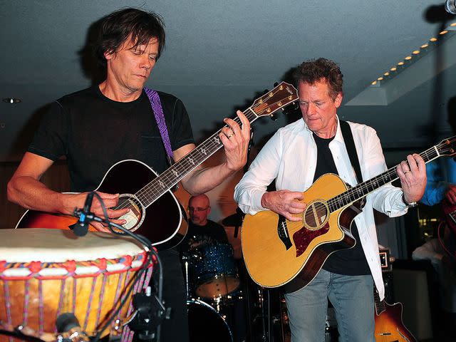 <p>Gustavo Caballero/Getty</p> Kevin Bacon and Michael Bacon perform in 2009.