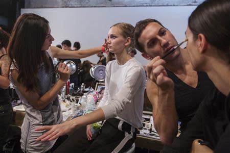 Models have their make up applied backstage before a presentation of the Honor Spring/Summer 2014 collection during New York Fashion Week, September 5, 2013. REUTERS/Lucas Jackson