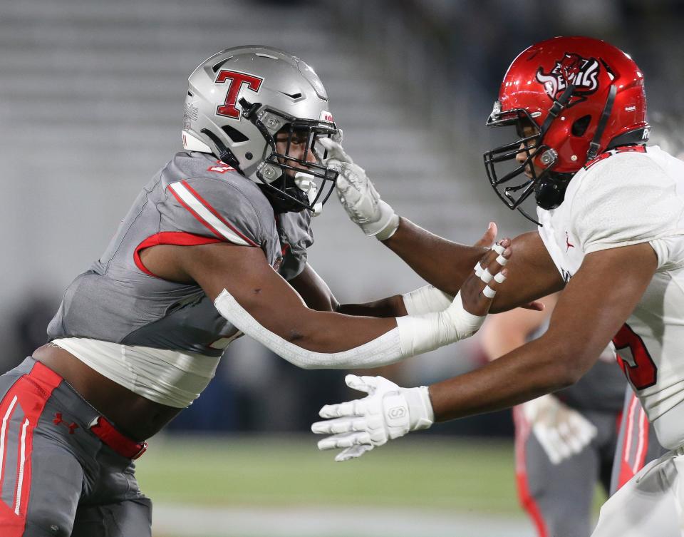 Thompson linebacker Jeremiah Alexander (7) rushes the passer and is blocked by Central offensive lineman Keyon Cox (59) during the 7A state championship game in Birmingham Wednesday, Dec. 1, 2021. [Staff Photo/Gary Cosby Jr]