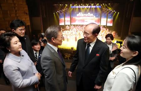 South Korean President Moon Jae-in talks with president of the Presidium of the Supreme People's Assembly of North Korea Kim Young Nam as Kim Yo Jong, the sister of North Korea's leader Kim Jong Un, looks on after North Korea's Samjiyon Orchestra's performance in Seoul, South Korea, February 11, 2018. Yonhap via REUTERS