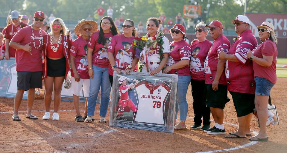 Oklahoma's Jocelyn Alo (78) poses for a picture with family during senior night after a Bedlam softball game between the University of Oklahoma Sooners (OU) and the Oklahoma State University Cowgirls (OSU) at Marita Hynes Field in Norman, Okla., Saturday, May 7, 2022. Oklahoma won 5-3. 