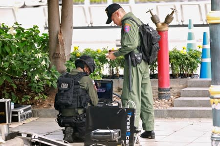 Police Explosive Ordnance Disposal (EOD) officers work following a small explosion at a site in Bangkok