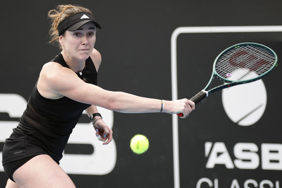 Elina Svitolina of Ukraine plays a backhand return to Emma Raducanu of Great Britain at the ASB Tennis Classic in Auckland, New Zealand, Thursday, Jan. 4, 2024. (David Rowland/Photosport via AP)