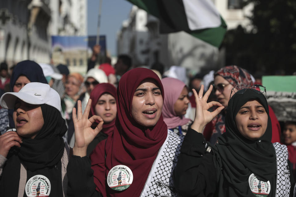 Women chant slogans, during a demonstration in Rabat, Morocco, Sunday, Feb. 9, 2020. Thousands of Moroccans took part in a march rejecting Trump's Middle East peace plan and in support of Palestinians. (AP Photo/Mosa'ab Elshamy)