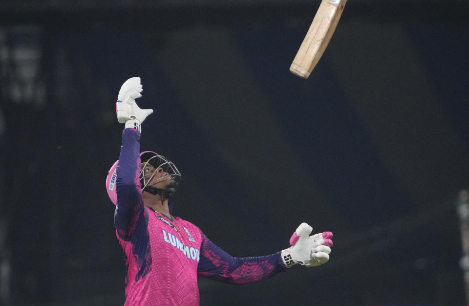 Rajasthan Royals's Shimron Hetmyer throws his bat after he was run out in the last over during the Indian Premier League (IPL) 2023 match between Punjab Kings and Rajasthan Royals, in Guwahati, India, Wednesday, April 5, 2023. (AP Photo/Anupam Nath)