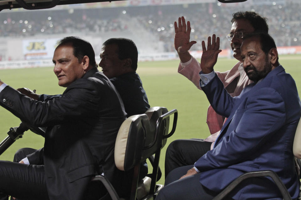 Mohammad Azharuddin, front, Gundappa Viswanath, back and Dilip Vengsarkar, rear, acknowledge the crowd during a grand parade of India's former cricket captains during the first day of the second test match between India and Bangladesh, in Kolkata, India, Friday, Nov. 22, 2019. (AP Photo/Bikas Das)