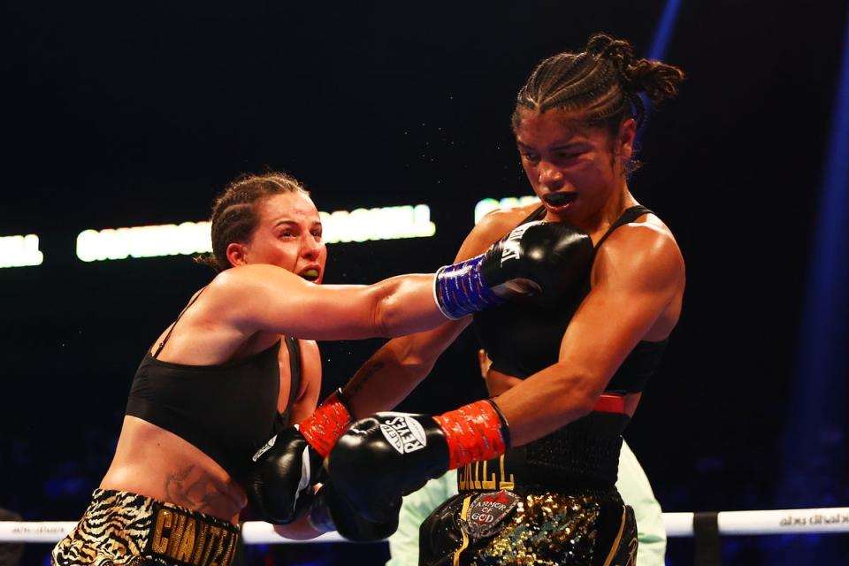 Cameron (left) is unbeaten, like Taylor, and also holds four world titles (Getty Images)