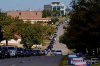 Voters wait in a long line of cars during early voting at the Oklahoma Election Board in Oklahoma City