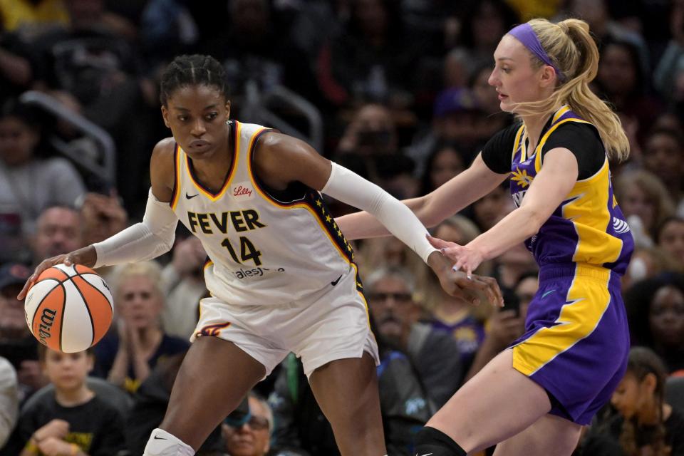 May 24, 2024; Los Angeles, California, USA; Indiana Fever center Temi Fagbenle (14) is guarded by Los Angeles Sparks forward Cameron Brink (22) in the second half at Crypto.com Arena. Mandatory Credit: Jayne Kamin-Oncea-USA TODAY Sports