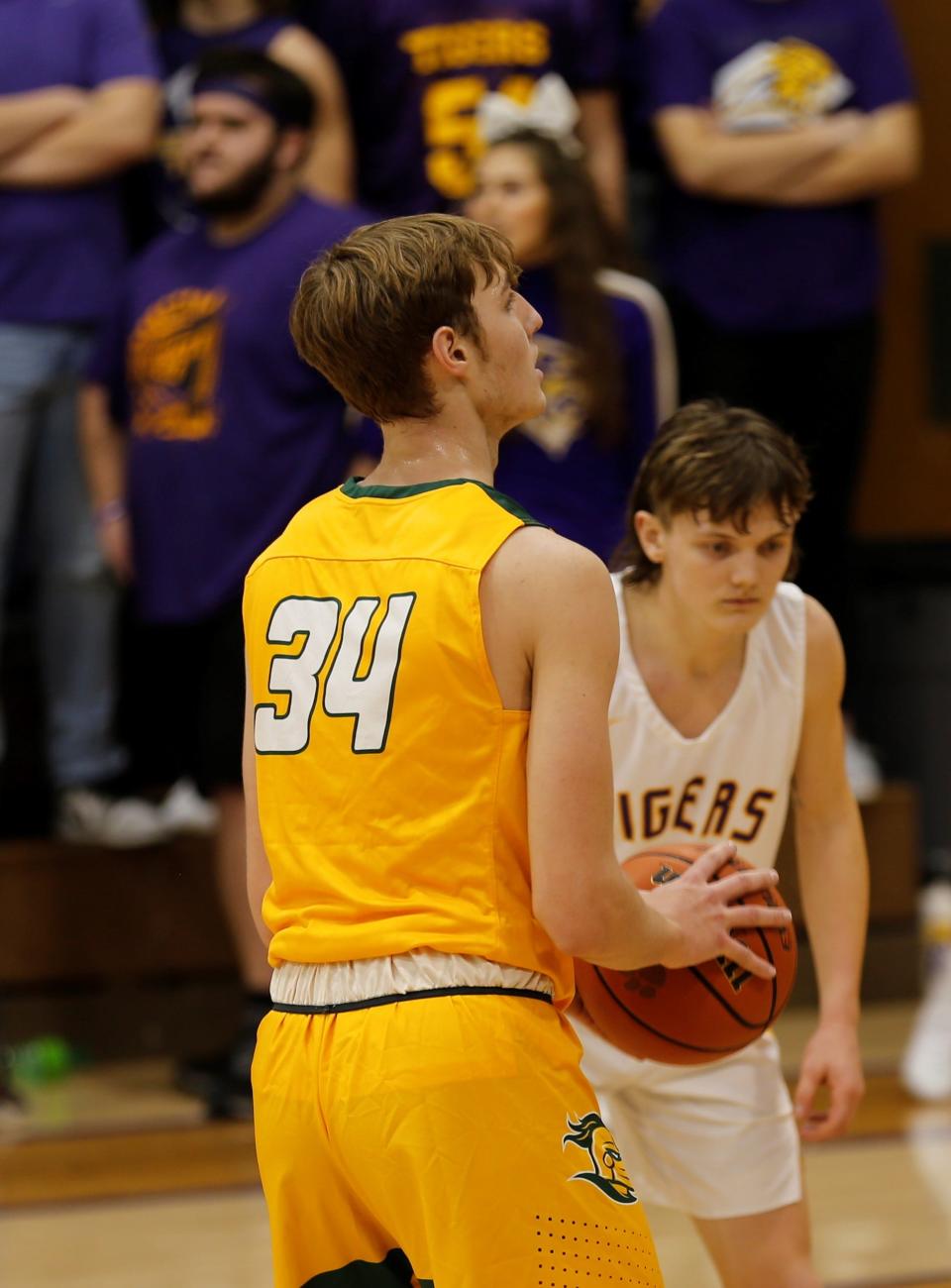 Northeastern senior Raedhyn Foust shoots a free throw while Hagerstown junior Mason Romack prepares to box out during the Wayne County Tournament championship Jan. 8, 2022.
