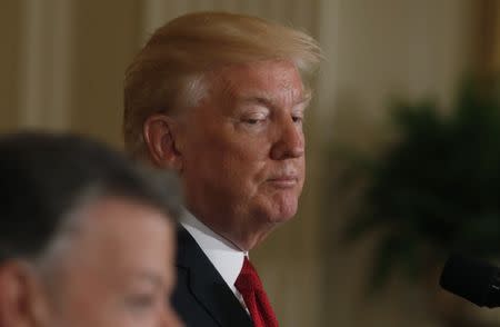 U.S. President Donald Trump looks over at Colombia's President Juan Manuel Santos (L) during their joint news conference at the White House in Washington, U.S. May 18, 2017. REUTERS/Yuri Gripas