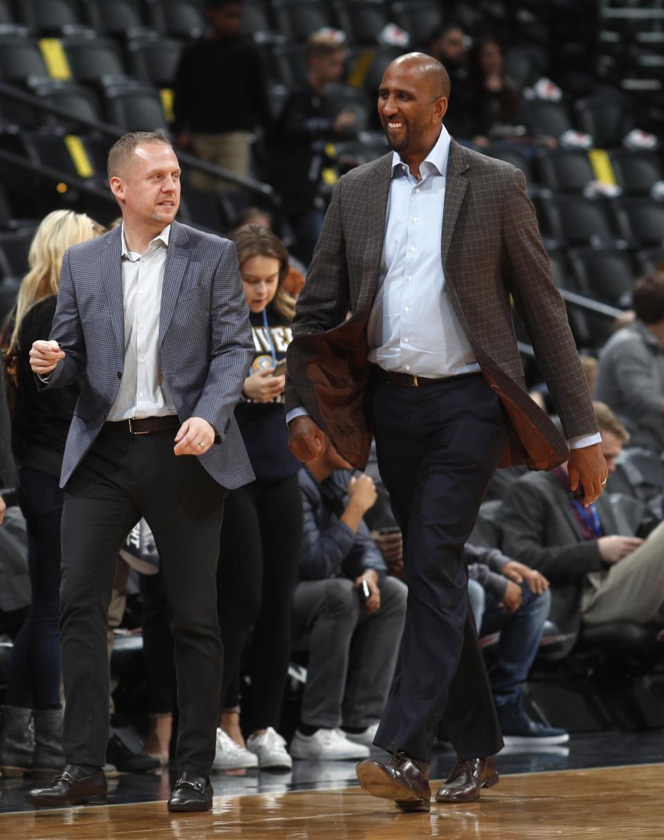 Penn State legend Calvin Booth (right) is now the general manager of the Denver Nuggets after a 10-year NBA career.