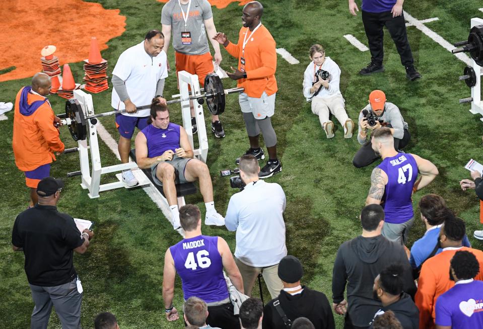 Baylon Spector, former Clemson defensive player, finishes lifting weights during Clemson Football Pro Day at the Poe indoor football facility in Clemson, S.C. Thursday, March 17, 2022. Players evaluated are considered by scouts of professional teams for the 2022 NFL Draft in Paradise, Nevada from April 28-30, 2022.