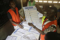 Electoral officials count ballot papers at the end of Presidential Election in one of the polling stations in Lome, Togo, Saturday, Feb. 22 2020. The West African nation of Togo is voting Saturday in a presidential election that is likely to see the incumbent re-elected for a fourth term despite years of calls by the opposition for new leadership. Photo/ Sunday Alamba)