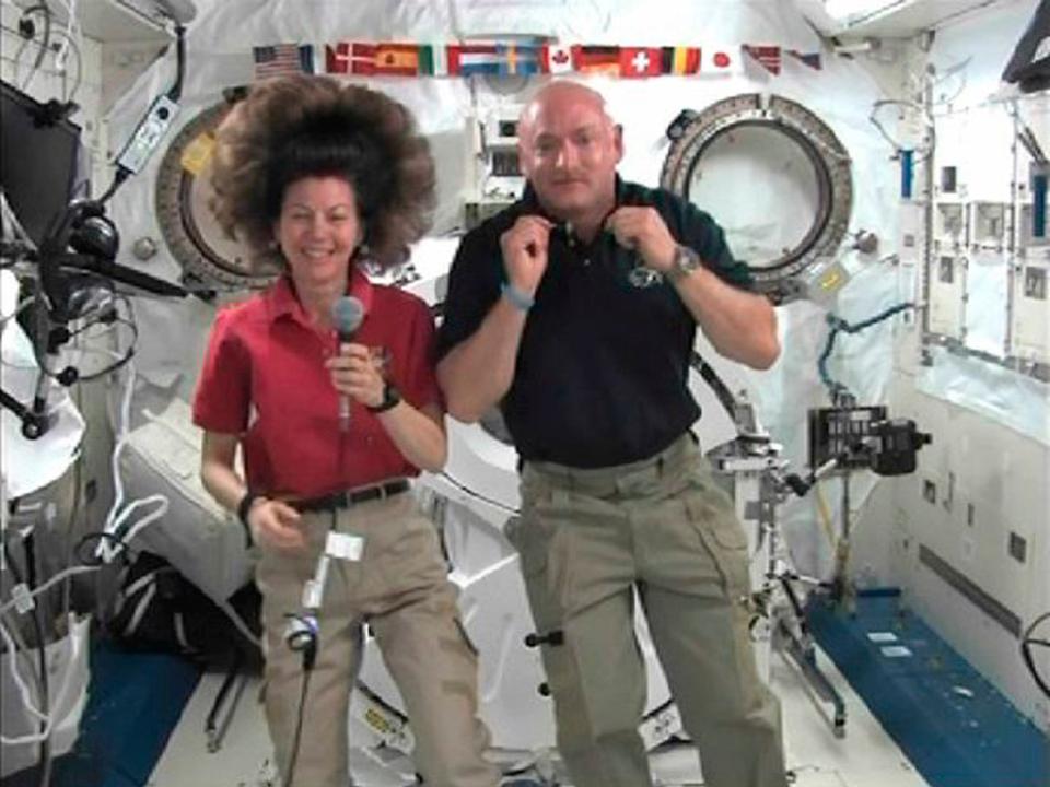 Space shuttle Endeavour Commander Mark Kelly shows Giffords' wedding ring on a chain around his neck.