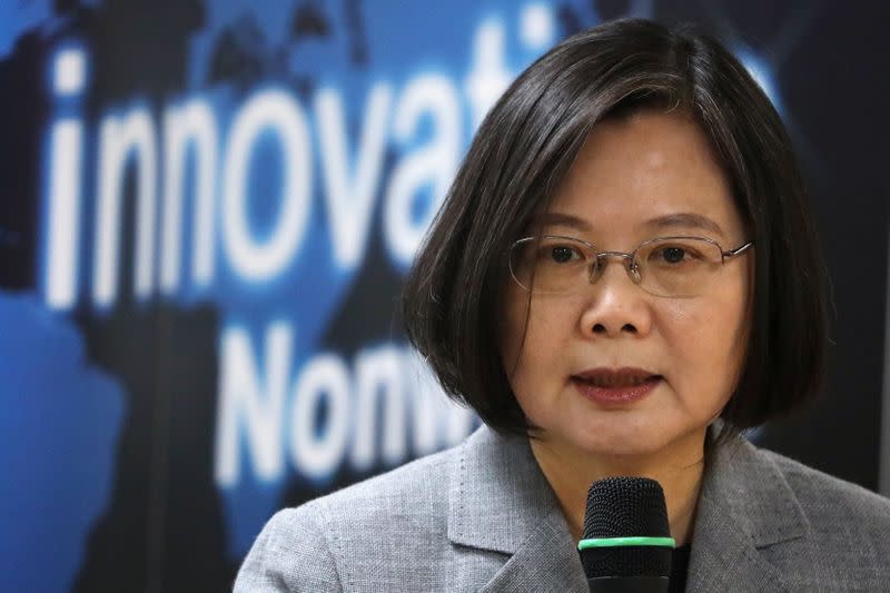 Taiwanese president Tsai Ing-Wen speaks at a non woven filter fabric factory, where the fabric is used to make surgical face masks, in Taoyuan