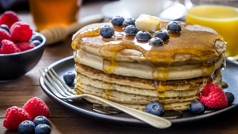 Pancakes with fruits and syrup