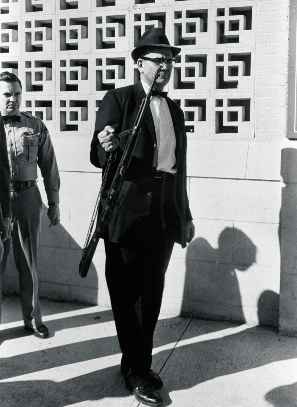 <p>An investigator removes from the Texas School Book Depository the rifle allegedly used to assassinate President Kennedy. (Photo: Corbis via Getty Images) </p>