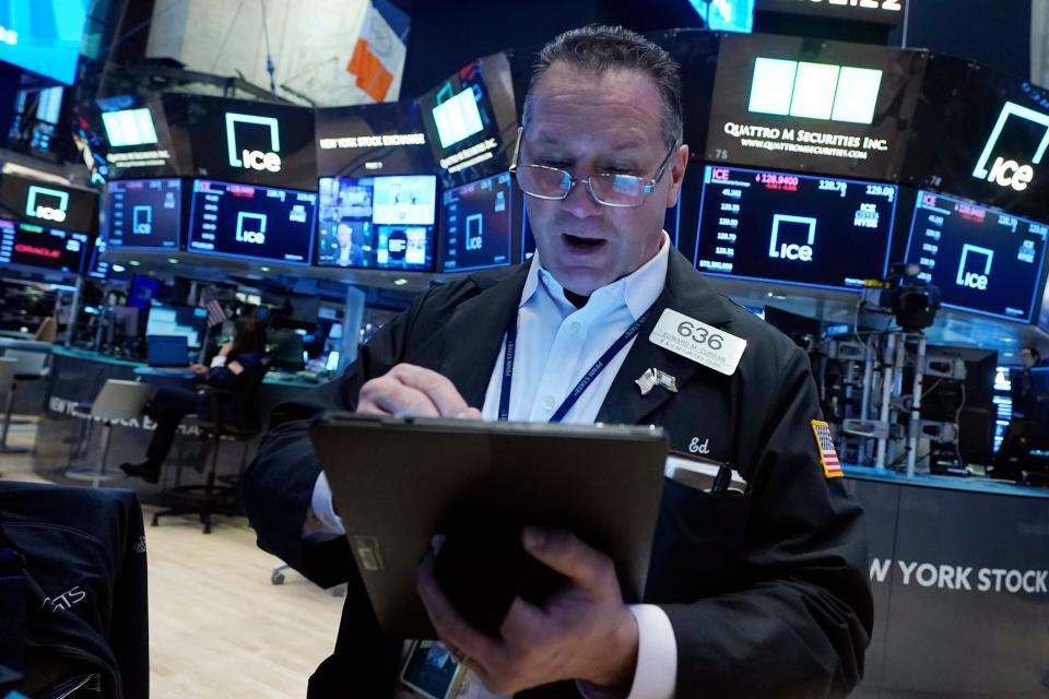 Edward Curran works on the floor of the New York Stock Exchange. Wall Street and FTSE down