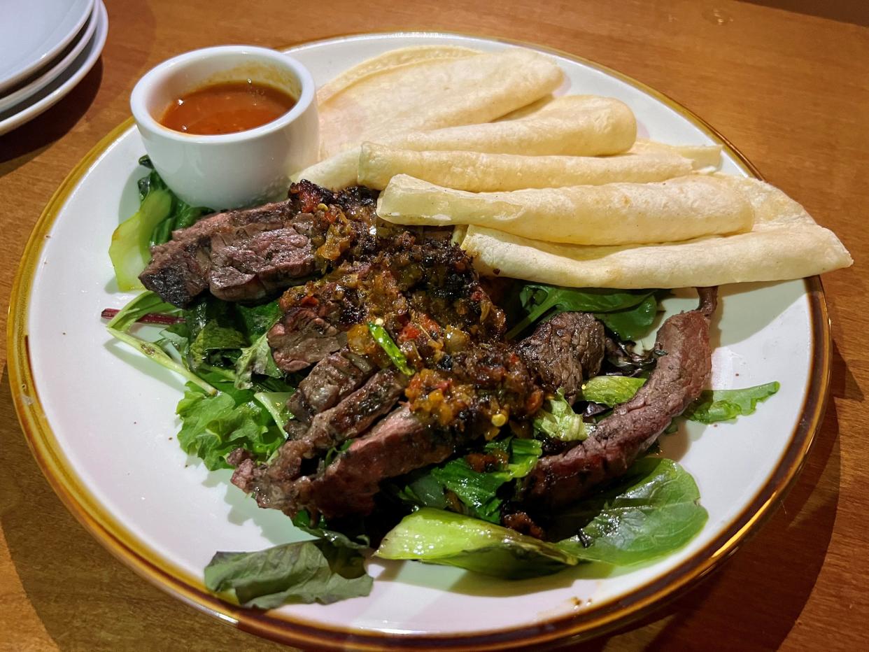 Steak arrachera, marinated and grilled skirt steak with chimi rojo and green onion at Mercado by Butchertown in Nashville's Wedgewood-Houston neighborhood on Nov. 12, 2023