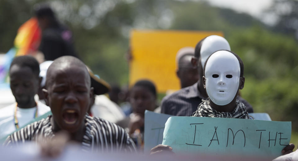 Ugandans take part in the 3rd Annual Lesbian, Gay, Bisexual and Transgender (LGBT) Pride celebrations in Entebbe, Uganda, Saturday, Aug. 9, 2014.  Scores of Ugandan homosexuals and their supporters are holding a gay pride parade on a beach in the lakeside town of Entebbe. The parade is their first public event since a Ugandan court invalidated an anti-gay law that was widely condemned by some Western governments and rights watchdogs. (AP Photo/Rebecca Vassie)