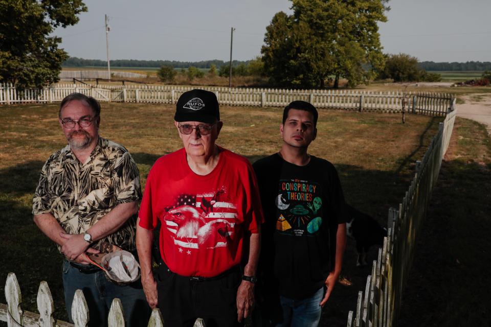 Three Circleville residents who are members of the Roundtown UFO Society(RUFOS -- from left, Jon Fry, Pete Hartinger and Cameron Jones -- visit what used to be the Pickaway County farm of Bruce Stevenson, who said that in 1948 he saw a UFO there.