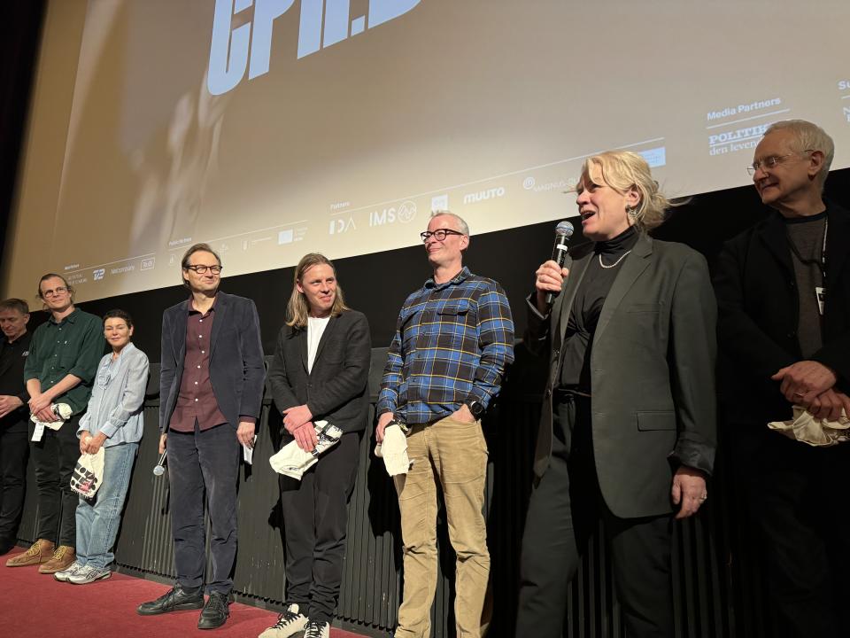 Producer Vibeke Vogel (with microphone) at the world premiere of 'Life and Other Problems' at CPH:DOX. To her left is co-producer John Archer.