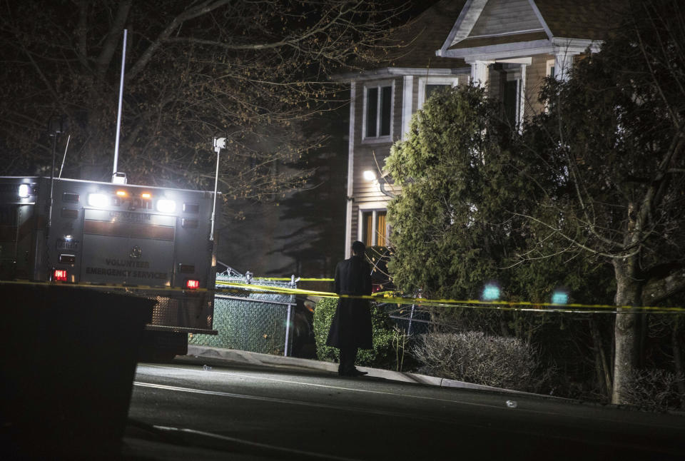 An Orthodox Jewish man stands in front of a residence in Monsey, New York, following a stabbing late Saturday during a Hanukkah celebration. (Photo: ASSOCIATED PRESS)