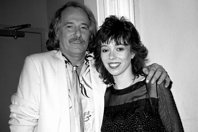 <p>Patrick McMullan/Getty</p> John and Mackenzie Phillips in February 1984