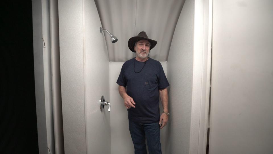 Hubbard showing off his bunker's shower 