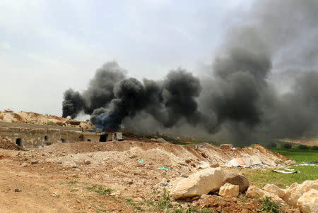 Smoke rises from an emergency service point after an airstrike at the rebel-held village of Maar Zita in Idlib province, Syria April 27, 2017. REUTERS/Ammar Abdullah