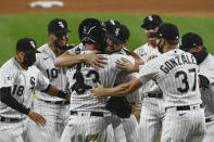 Chicago White Sox starting pitcher Lucas Giolito, center, celebrates with teammates after closing out a no-hitter in the team's baseball game against the Pittsburgh Pirates, Tuesday, Aug. 25, 2020, in Chicago. (AP Photo/Matt Marton)
