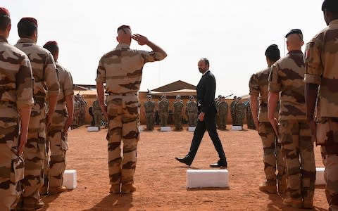 French Prime Minister Edouard Philippe reviews the troops at a French military base in Mali last month - Credit: ALAIN JOCARD/AFP/Getty Images