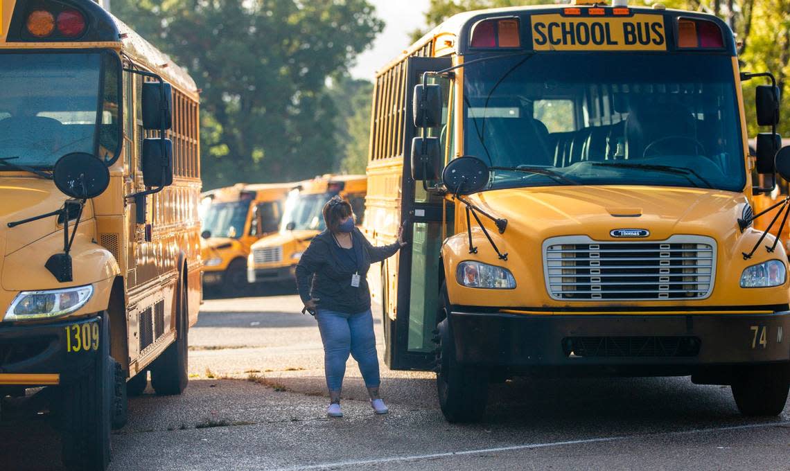 A Wake County school bus driver returns to a parking area on Capital Blvd. in Raleigh after completing a morning route Friday, Oct. 29, 2021.