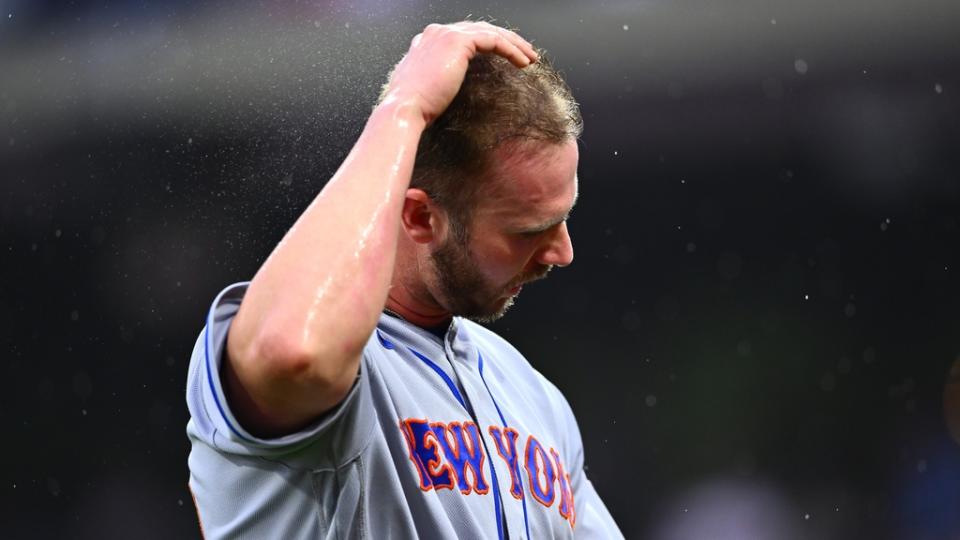 Jun 23, 2023; Philadelphia, Pennsylvania, USA; New York Mets first baseman Pete Alonso (20) wipes rain from his hair against the Philadelphia Phillies in the second inning at Citizens Bank Park.