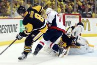 May 4, 2016; Pittsburgh, PA, USA; Pittsburgh Penguins goalie Matt Murray (30) makes a save against Washington Capitals right wing T.J. Oshie (77) as defenseman Brian Dumoulin (8) defends during the third period in game four of the second round of the 2016 Stanley Cup Playoffs at the CONSOL Energy Center. Mandatory Credit: Charles LeClaire-USA TODAY Sports