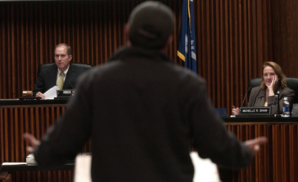 Mayor Knox White, left, and city councilwoman Michelle Shain, right, listen to Omar Naji, owner of the Blu Martini, during a forum on the proposed smoking ban in downtown Greenville on Monday, October 23, 2006.
Staff Photo/Heidi Heilbrunn