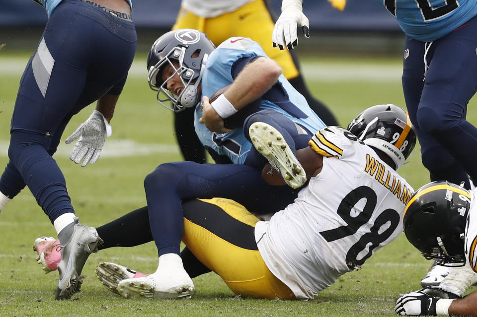 Tennessee Titans quarterback Ryan Tannehill (17) is sacked by Pittsburgh Steelers inside linebacker Vince Williams (98) for a 3-yard loss in the second half of an NFL football game Sunday, Oct. 25, 2020, in Nashville, Tenn. (AP Photo/Wade Payne)