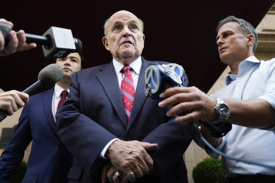 FILE - Former Mayor of New York Rudy Giuliani speaks to reporters as he leaves his apartment building in New York, Wednesday, Aug. 23, 2023. Giuliani on Friday, Sept. 1, pleaded not guilty to Georgia charges that accuse him of trying, along with former President Donald Trump and others, to illegally overturn the results of the 2020 election in the state. (AP Photo/Seth Wenig, File)