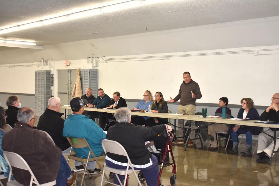 Adrian City Administrator Greg Elliott, standing, discusses some background information with Adrian residents Monday, Feb. 12, 2024, regarding Crimson Holdings LLC, an egg processing facility in east Adrian that has been cited for nuisance odor violations multiple times since starting its business in December 2021.