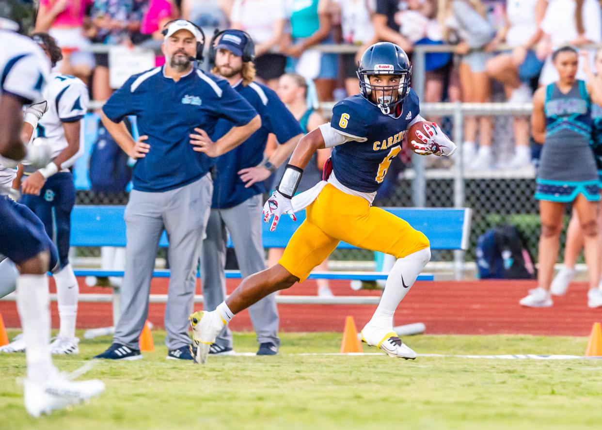 Chantz Babineaux runs the ball as the Carencro bears take on the Southside Sharks.   Friday, Sept. 16, 2022.