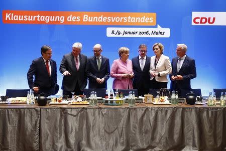 German Chancellor and leader of the Christian Democratic Union (CDU) Angela Merkel arrives with her deputy party leaders for the start of a two-day CDU party leadership meeting in Mainz, Germany January 8, 2016. Pictured (L-R) Armin Laschet, Volker Bouffier, secretary general Peter Tauber, Guido Wolf, Julia Kloeckner and Thomas Strobl REUTERS/Kai Pfaffenbach