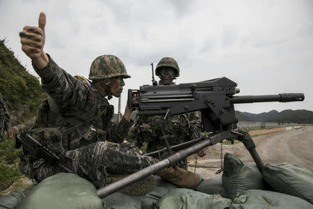 FILE PHOTO: South Korean marines take part in a military exercise on South Korea's Baengnyeong Island, near the disputed sea border with the north, in this handout picture provided by South Korean Marine Corps and released by Yonhap, September 7, 2017. South Korean Marine Corps/Yonhap via REUTERS