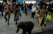 <p>A woman stumbes as people run down Oxford Street, London, Britain, Nov. 24, 2017. (Photo: Peter Nicholls/Reuters) </p>