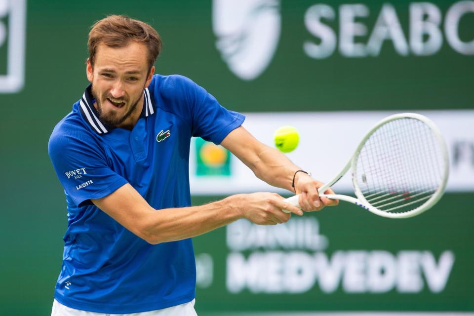 Daniil Medvedev returns to Carlos Alcaraz during the BNP Paribas Open men's final at the Indian Wells Tennis Garden in Indian Wells, CA, on March 17, 2024.